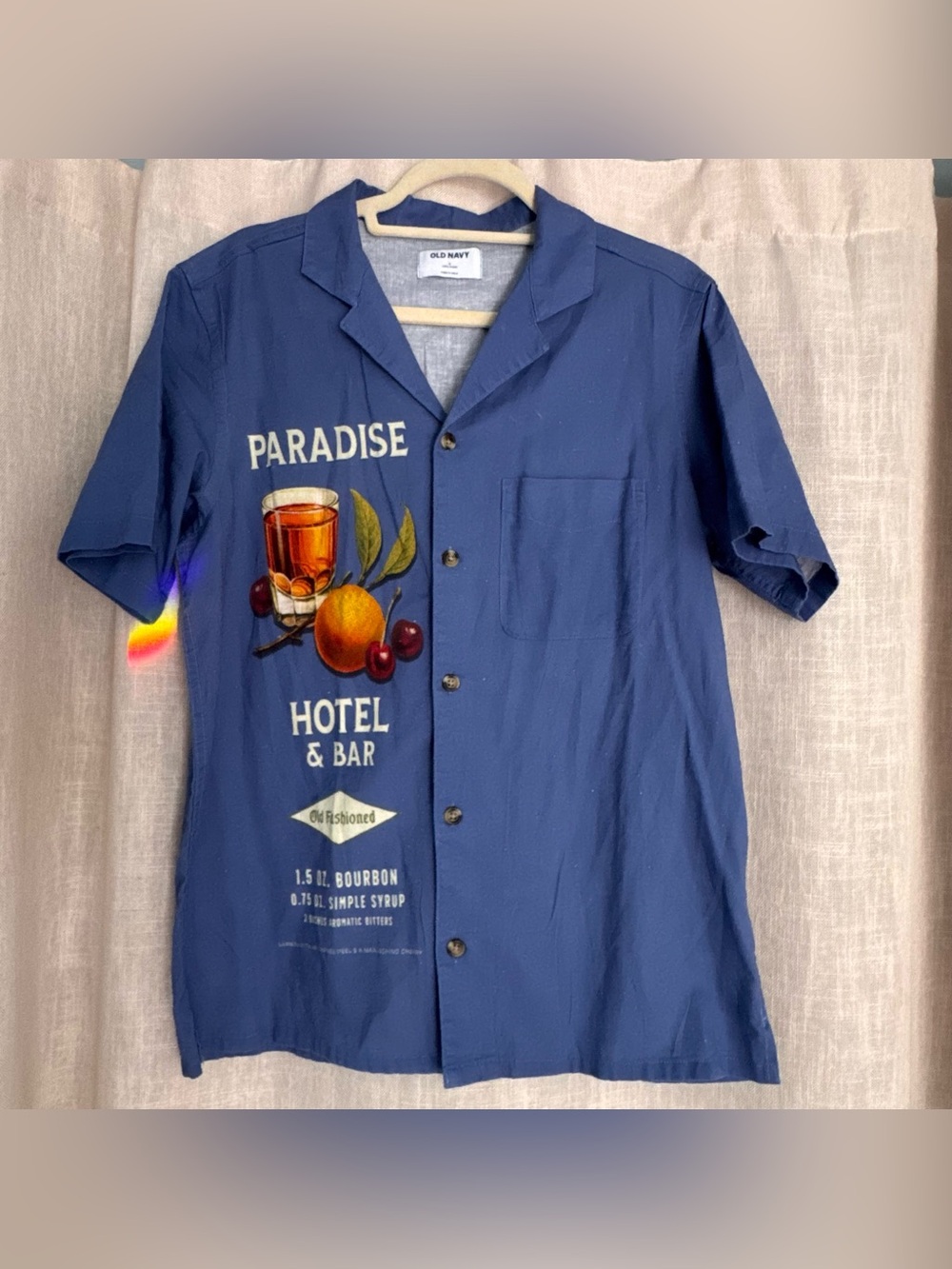 Men’s blue button down linen shirt cocktail design on front